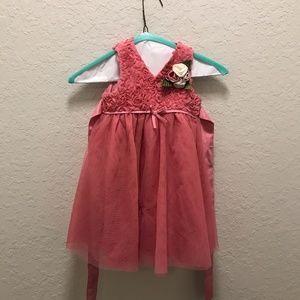 little girl’s pink dress with flowers